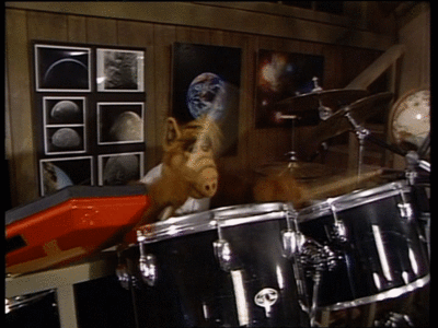 Animated GIF of ALF playing drums